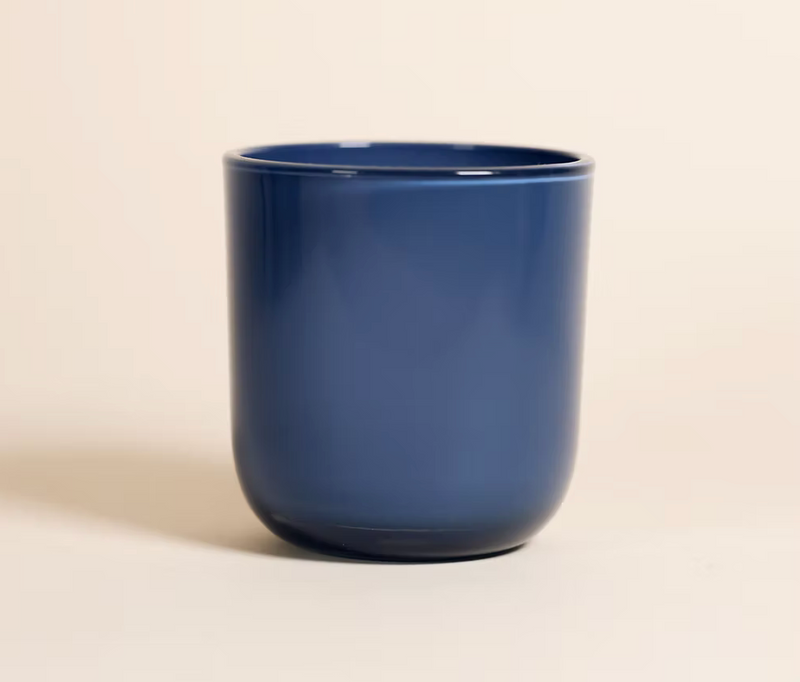 Festival of Lights Hanukkah candle in cobalt blue jar with engraved wood lid featuring Menorah, Star of David, dreidel, and gifts”