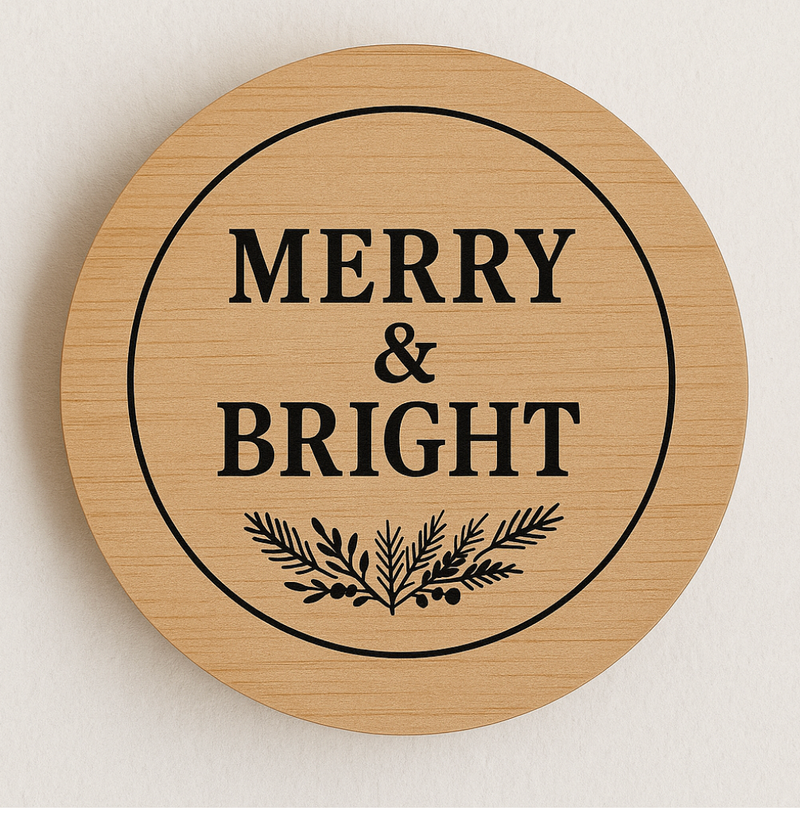 Round wooden sign with 'Merry & Bright' text and leaf design on a light background