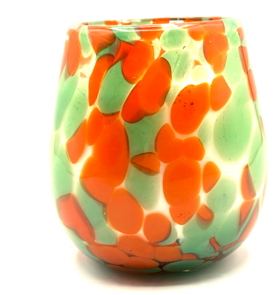 Green and gray speckled glass candle with soothing fragrance, hand-poured in clean-burning olive oil wax. Artisan design, limited edition.